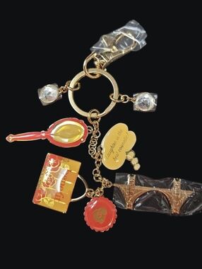 Benefit Gold-Tone Purse Charm / Keychain with Red & Yellow Enamel Charms